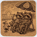 Raccoons at Sunset Beach Scene - Laser Engraved Cork Coaster