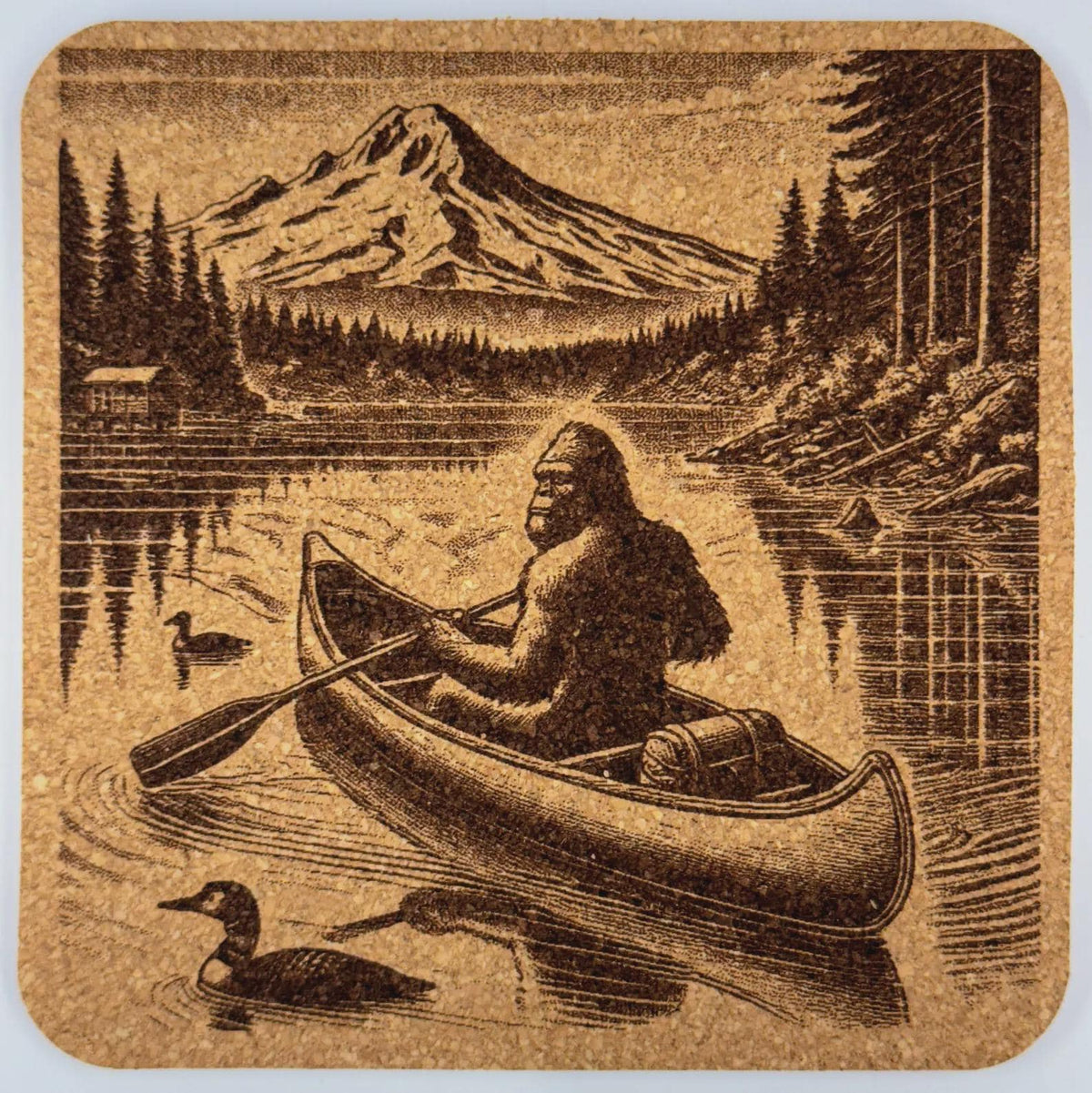Bigfoot Canoeing Cork Coaster – Sasquatch Paddling Mt Hood Lake Scene