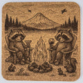 Relaxed Raccoons by the Campfire – Mountain Lake Sunset Laser Engraved Cork Coaster